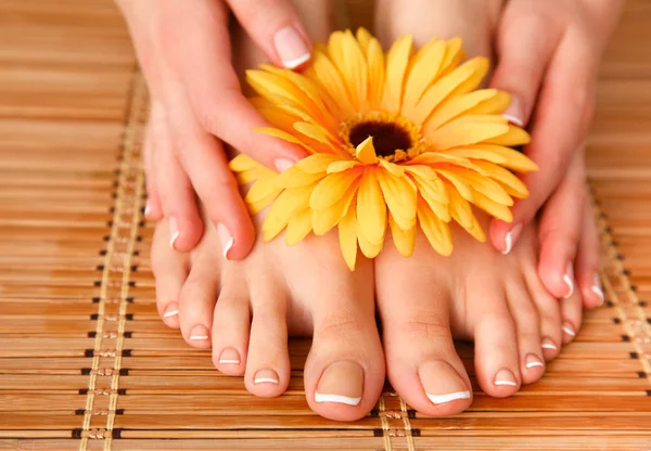 Care for beautiful woman legs on the floor — Stock Photo, Image