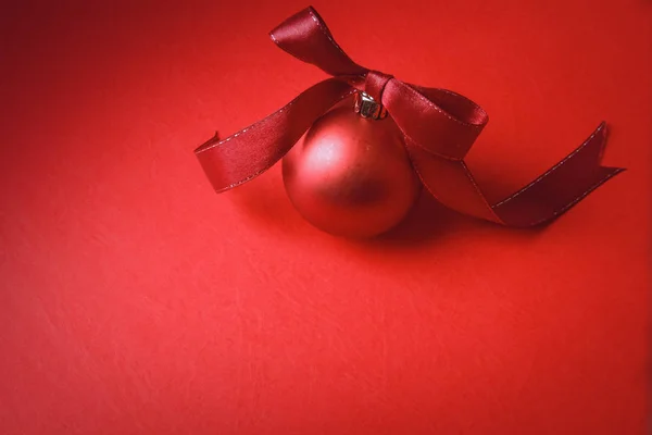 Red christmas ball with tape isolated on background — Stock Photo, Image