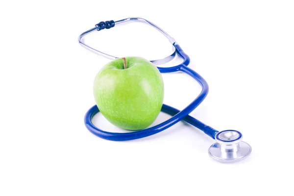 Stéthoscope médical et pomme isolés sur fond blanc — Photo