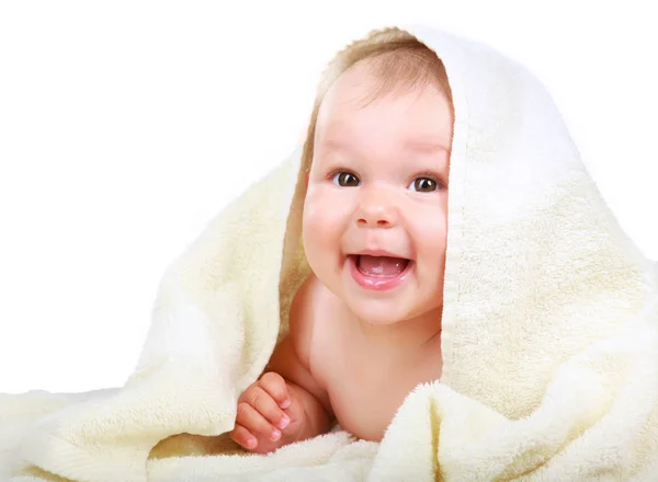 Bellissimo bambino sdraiato su un asciugamano beige — Foto Stock