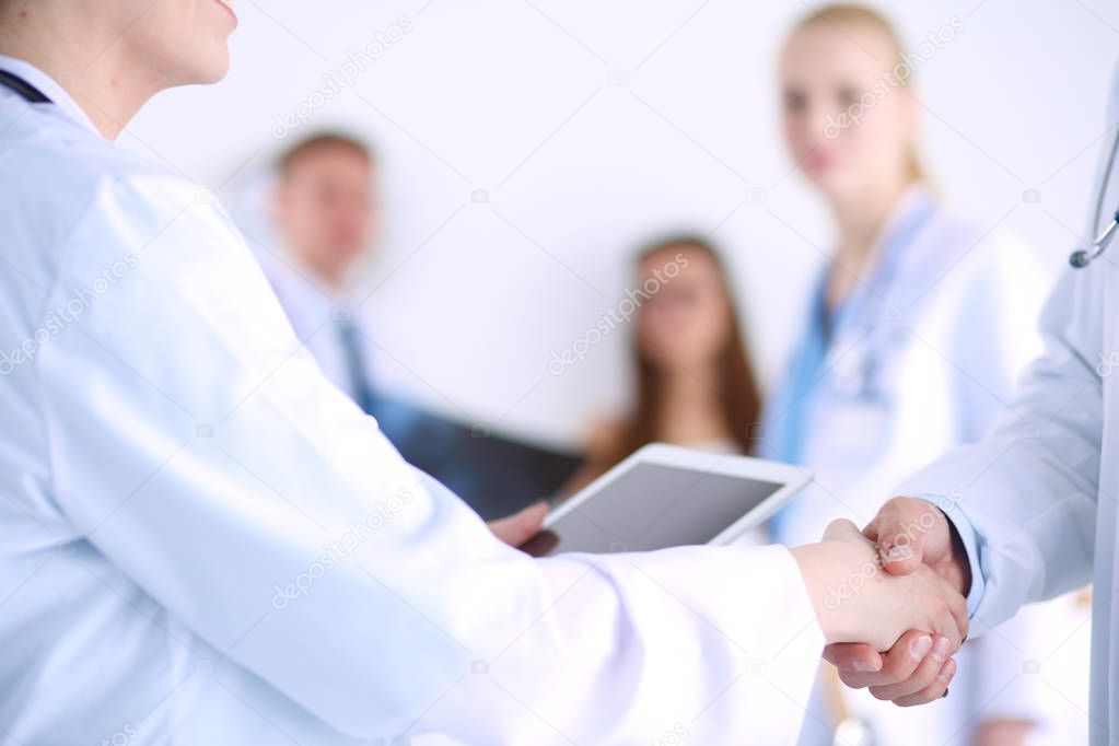 Young woman doctor holding a tablet pc . Young woman doctor.
