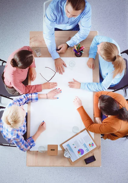 Business people sitting and discussing at business meeting, in office — Stock Photo, Image