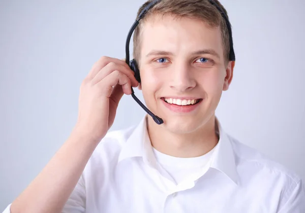 Klantenondersteuning operator met een headset op witte achtergrond — Stockfoto