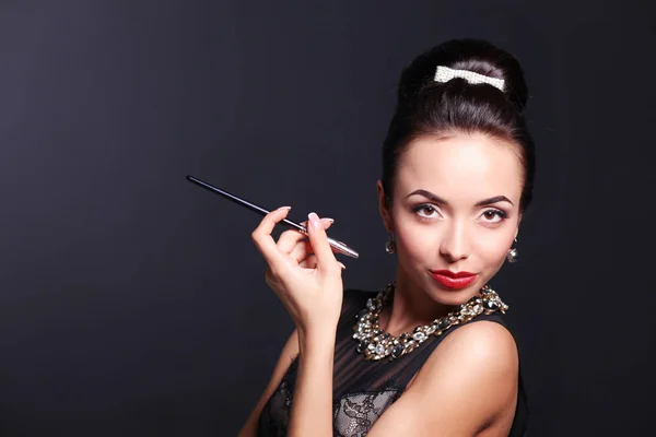 Retro woman portrait, standing on the black background — Stock Photo, Image