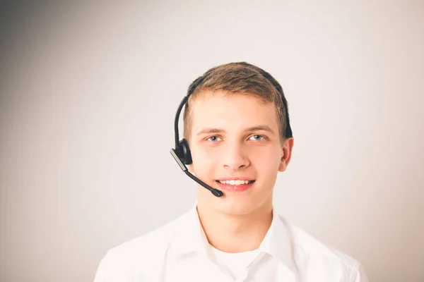 Kundsupport operatören med ett headset på vit bakgrund — Stockfoto