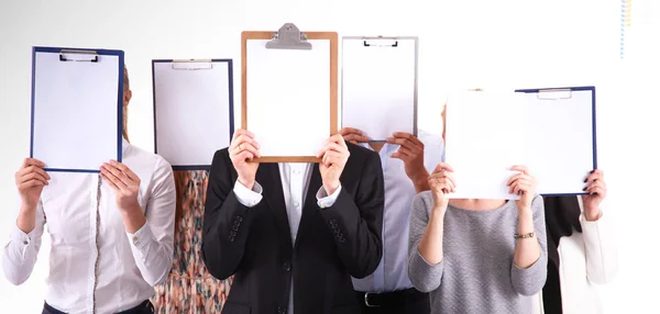 Team of businesspeople holding a folders near face isolated on white background . Businesspeople. — Stock Photo, Image