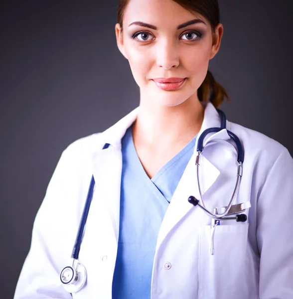 Doctor woman with stethoscope isolated on grey background — Stock Photo, Image