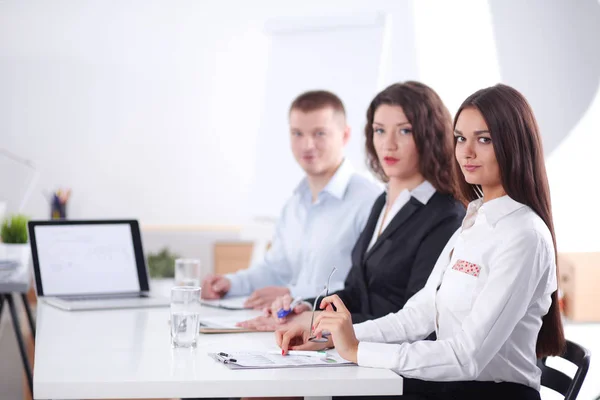 Business people sitting and discussing at business meeting, in office. Business people — Stock Photo, Image