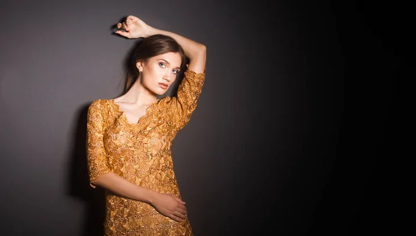 Attractive woman in yellow dress — Stock Photo, Image