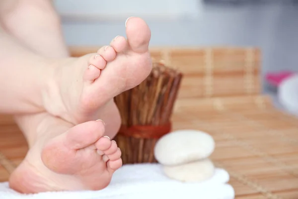 Care for beautiful woman legs on a towel. Beautiful woman legs — Stock Photo, Image