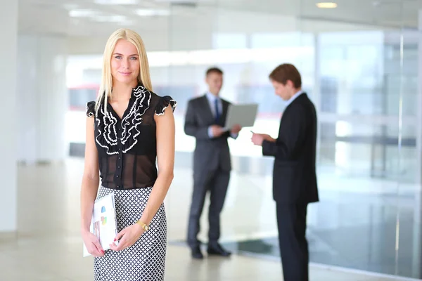 Happy businesswoman holding a paper. — Stock Photo, Image