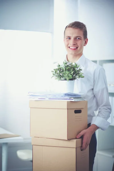 Portrait of young man smiling sitting on gray background. Portrait of young man — Stock Photo, Image