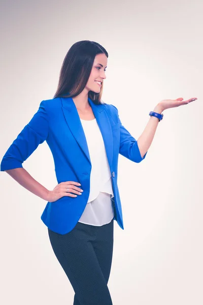 Portrait of young business woman pointing — Stock Photo, Image