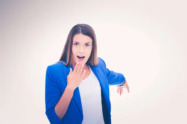 Portrait of young business woman pointing — Stockfoto