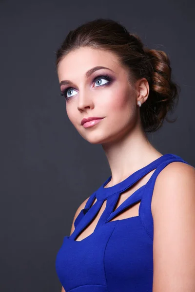 Studio shot of a beautiful young woman wearing professional makeup. — Stock Photo, Image