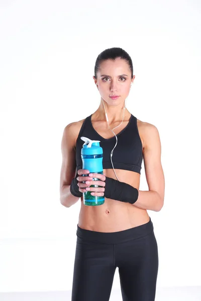 Chica con botella en las manos después del deporte. —  Fotos de Stock