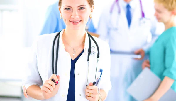 Woman doctor standing with stethoscope at hospital — Stock Photo, Image