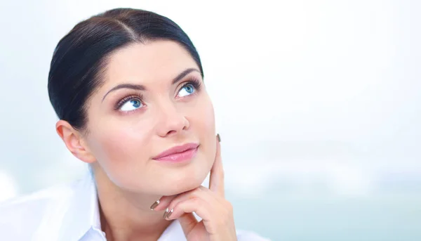 Attractive businesswoman sitting  on desk in the office — Stock Photo, Image