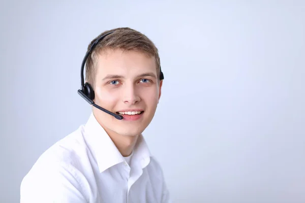 Portrait of young man smiling sitting on gray background. Portrait of young man — Stock Photo, Image