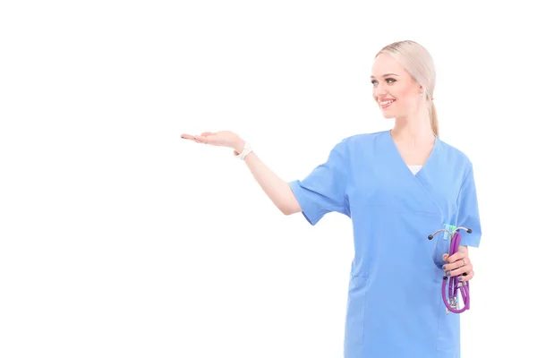 A portrait of a female doctor pointing, close-up, isolated on white background. Woman doctor — Stock Photo, Image