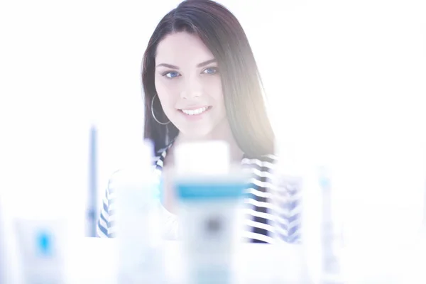 Beautiful young woman in shop — Stock Photo, Image