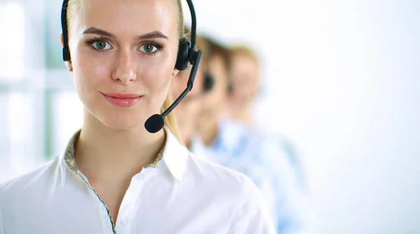 Attractive positive young businesspeople and colleagues in a call center office — Stock Photo, Image