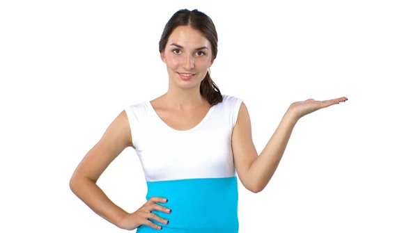 Portrait of a smiling young woman pointing up — Stock Photo, Image