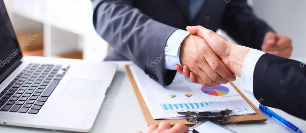 Business people shaking hands, finishing up a meeting