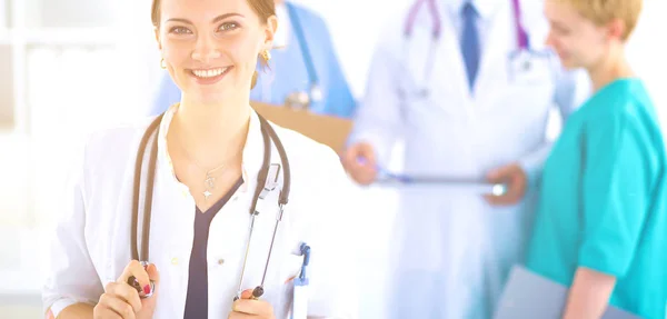 Woman doctor standing with stethoscope at hospital — Stock Photo, Image