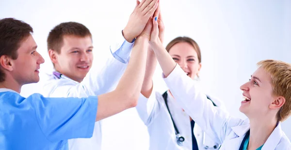 医療チームの医師と看護師が手を積み — ストック写真