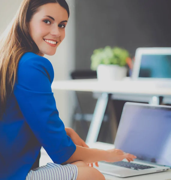 Businesswoman sitting on the sofa — Stock Photo, Image