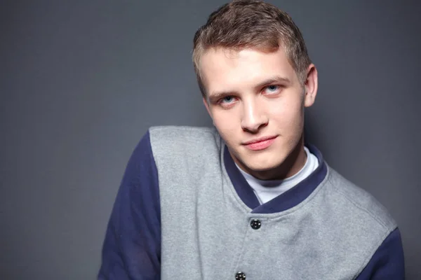 Portrait of a young man on black background.portrait of a young man. — Stock Photo, Image