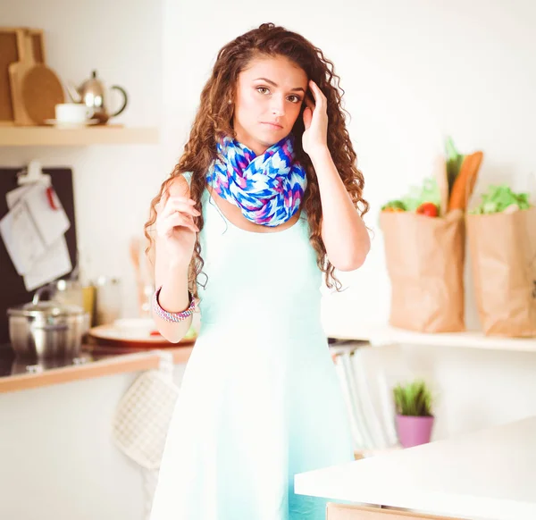 Pretty woman drinking some wine at home in kitchen . Pretty woman — Stock Photo, Image