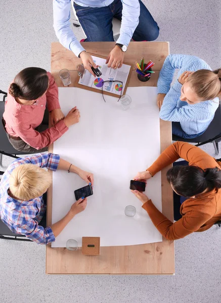 Business people sitting and discussing at meeting, in office — Stock Photo, Image