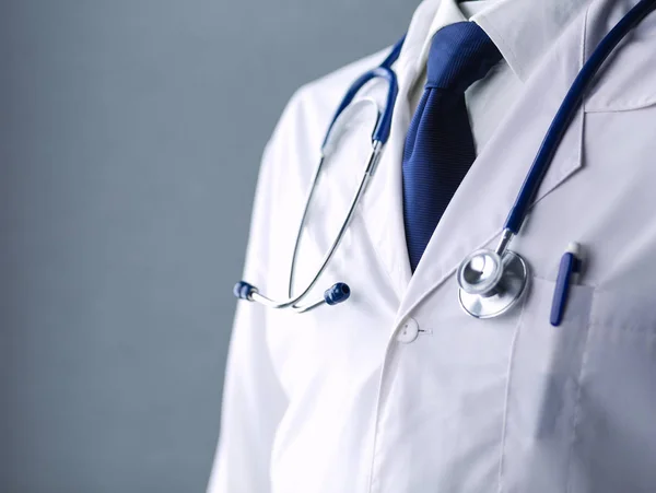 Medical doctor with a stethoscope standing in office — Stock Photo, Image