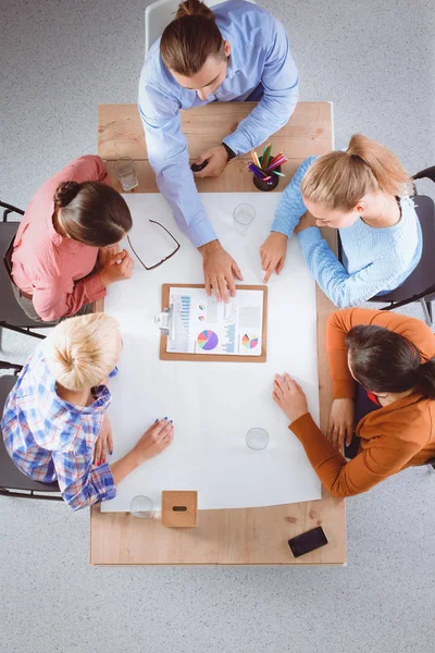 Business people sitting and discussing at meeting, in office — Stock Photo, Image