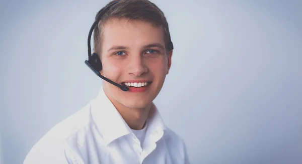 Kundsupport operatören med ett headset på vit bakgrund — Stockfoto