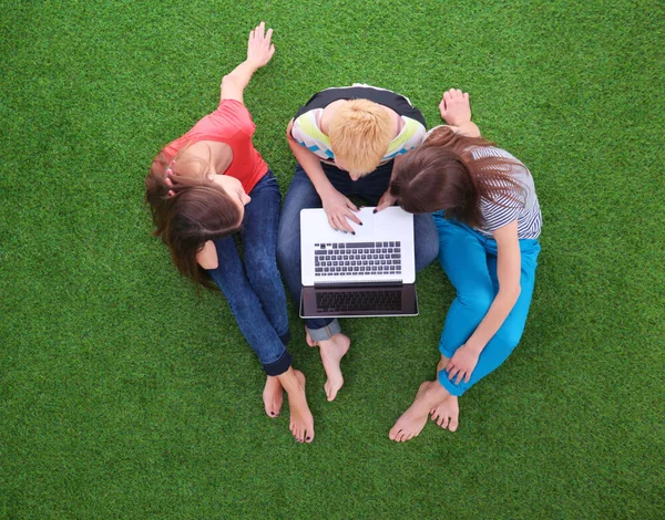 Young women lying on green grass . Young women — Stock Photo, Image