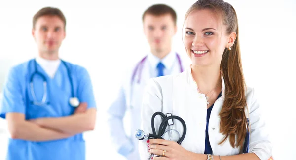 Attractive female doctor in front of medical group — Stock Photo, Image