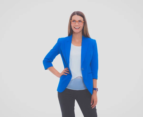 Portrait of a confident young woman standing isolated on white background — Stock Photo, Image