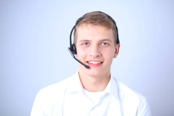 Portrait of young man smiling sitting on gray background. Portrait of young man — Stock Photo, Image