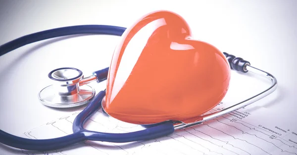 Red heart and a stethoscope on desk — Stock Photo, Image