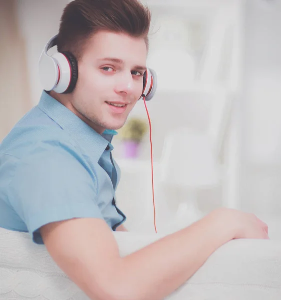 Man listening music with headphones at home — Stock Photo, Image