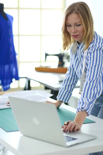 Fashion designer working on her designs in the studio — Stock Photo, Image