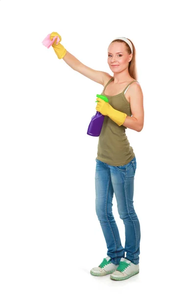 Cheerful woman is cleaning something with wisp and spray attentively. — Stock Photo, Image
