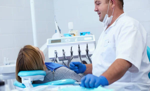 Doctor and patient in the dental clinic