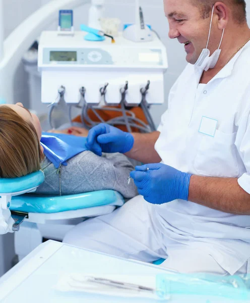 Doctor and patient in the dental clinic