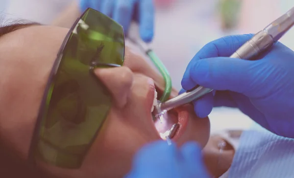 Dental team and patient at dentists surgery — Stock Photo, Image