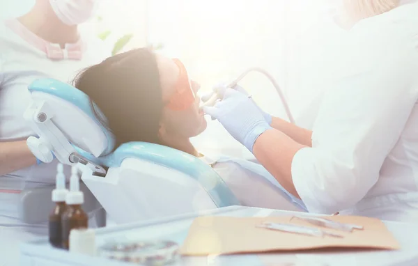 Young woman dentist at work in the office — Stock Photo, Image