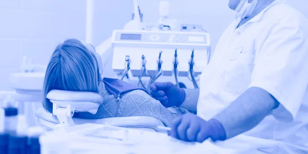 Doctor and patient in the dental clinic